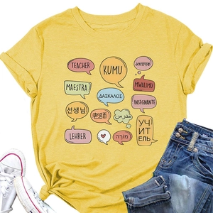 Detail of yellow teacher t-shirt featuring multilingual kumu and maestra print