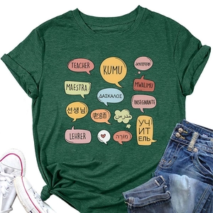 Detail view of dark green t-shirt with multilingual teacher print and denim jeans