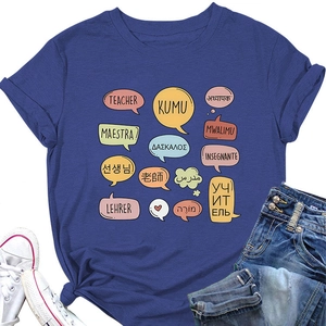 Flat lay of a blue cotton teacher T-shirt featuring multilingual graphics and denim shorts