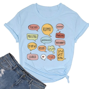 Detail of light blue cotton T-shirt featuring multilingual teacher print and side knot hem