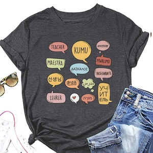 Detailed view of dark grey teacher t-shirt featuring multilingual graphic design