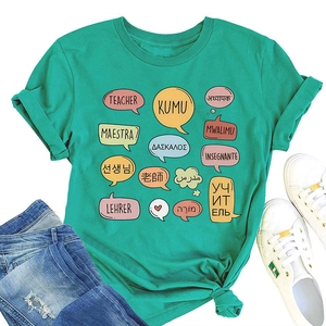 Flat lay of teacher theme green cotton t-shirt with multi-language graphic print and jeans