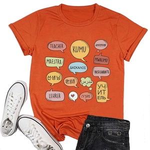 Flat lay of an orange teacher T-shirt with colorful multilingual speech bubble prints