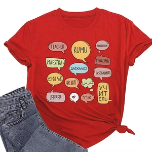 Detail of red teacher t-shirt featuring multi-language graphics and stylish knotted hem