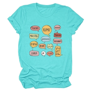 Detailed flat lay of teacher theme t-shirt featuring multi-language graphics on blue fabric
