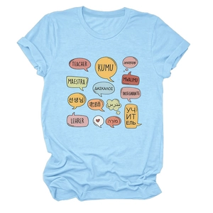 Close-up of light blue cotton T-shirt featuring colorful multilingual teacher text graphics