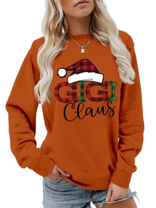 Λεπτομέρεια από πορτοκαλί φούτερ Gigi Claus με χριστουγεννιάτικο τύπωμα