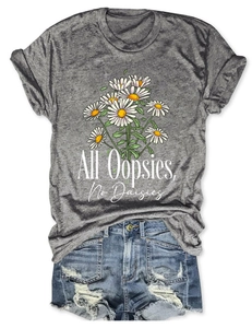 Close-up of All Oopsies No Daisies print on heather grey t-shirt with denim shorts