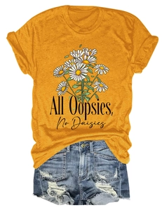 Detail of yellow cotton t-shirt with daisy print and distressed denim shorts