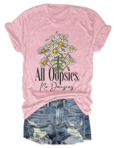 Flat lay of pink daisy graphic T-shirt and distressed denim shorts fashion set