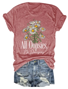 Flat lay of a red T-shirt with daisy print and distressed denim shorts summer outfit set