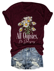 Detail of burgundy T-shirt with All Oopsies No Daisies print and distressed denim shorts