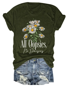 Close-up of All Oopsies No Daisies print on a dark green tee with distressed denim shorts