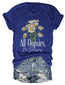 Detail of blue T-shirt with daisy print and distressed denim shorts summer set