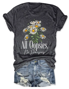 Close-up of All Oopsies No Daisies print on grey cotton t-shirt with denim shorts
