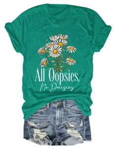 Green T-shirt with 'All Oopsies, No Daisies' print paired with ripped denim shorts