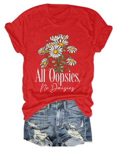 Detail of red t-shirt with All Oopsies No Daisies text and daisy print on cotton fabric