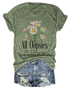 Detail of olive green t-shirt with daisy print and distressed denim shorts with frayed edges