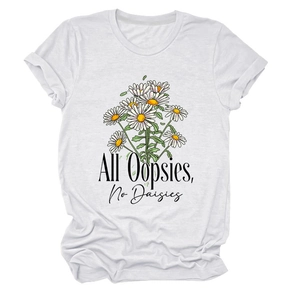 Detailed flat lay of white cotton T-shirt featuring daisy bouquet and artistic text