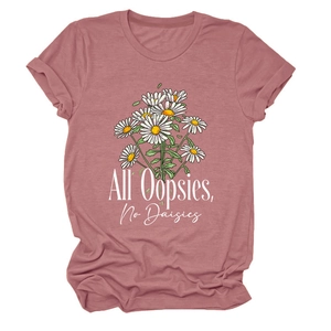 Flat lay of dusty rose T-shirt with daisy bouquet print and All Oopsies No Daisies text