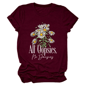 Detail of burgundy T-shirt showing All Oopsies No Daisies daisy print and soft cotton fabric