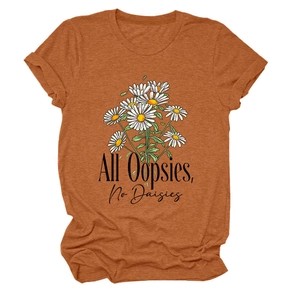 Detail of burnt orange T-shirt featuring All Oopsies No Daisies daisy graphic print
