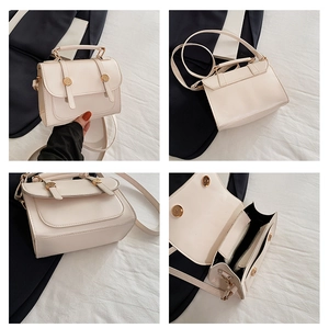 Detail view of cream PU leather handbag showing interior space and golden hardware