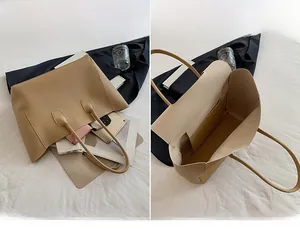 Detailed interior of a beige tote bag showing its large capacity for daily essentials