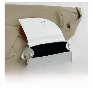 Top view of white trapezoid bag showing spacious black lining and magnetic closure