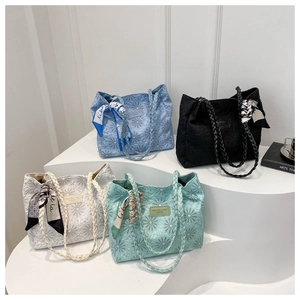 Canvas tote bags with floral embroidery and silk ribbons in four pastel color options