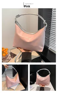 Pink fashion tote bag featuring silver knotted strap and stylish letter print detail