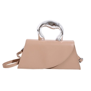 Minimalist beige trapezoid handbag with sculptural silver metal handle and shoulder strap