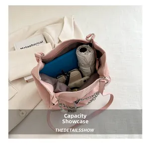 Pink faux leather tote bag interior showing spacious storage for laptop and daily essentials