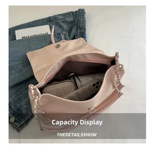 Interior view of soft pink tote showing large capacity for daily items and phone