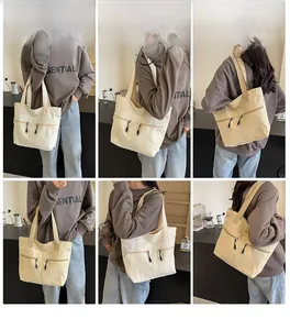 Multi-angle views of a large canvas tote bag with functional front zipper pockets