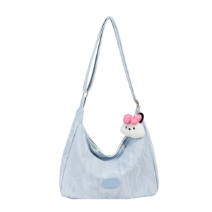 Light blue pleated shoulder bag with soft texture and cute white plush charm accessory
