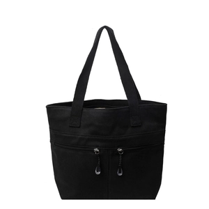 Black canvas tote bag with front zipper pockets for daily minimalist commuting wear