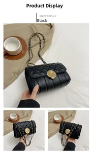 Detail of black quilted chain bag featuring a metallic twist lock and woven strap