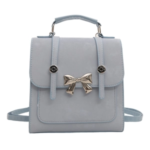 Elegant light blue-grey leather bucket bag with silver metal bow and top handle