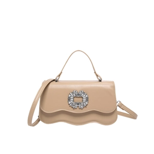 Elegant beige crossbody bag with rhinestone buckle and stylish wavy edge design
