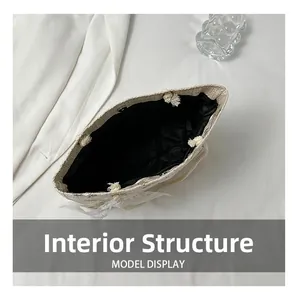 Detailed internal structure of straw tote bag with black lining and magnetic snap