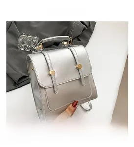Close-up of the silver matte metallic texture and buckle detail on this modern backpack