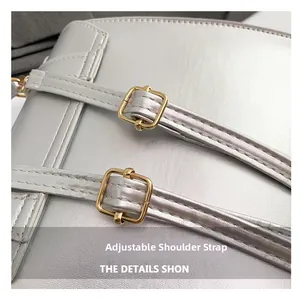Detail of adjustable silver leather straps with premium gold metal hardware buckles