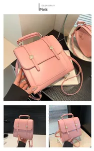 Pink PU leather square backpack detail with gold metal buckles and top handle