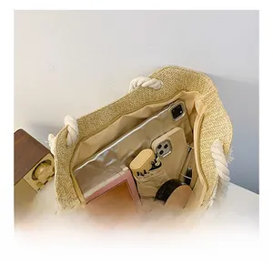 Large capacity straw tote bag showing spacious interior with tablet and daily essentials