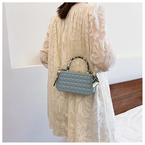 Light blue plaid box handbag with gold chain strap and decorative silk scarf handle wrap