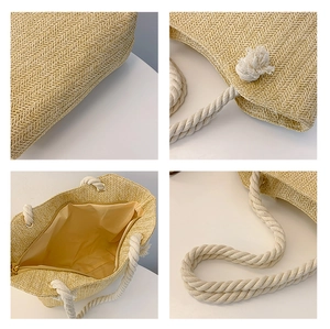 Detail of straw beach bag with herringbone weave, rope handles, and zipper lining