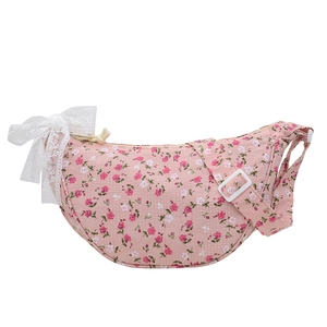 Pink floral crescent crossbody bag with white lace bow and adjustable shoulder strap