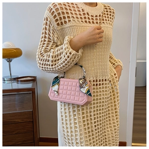 Pink checkered box handbag with elegant silk scarf wrap on the golden chain strap