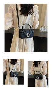 Detail of black quilted crossbody bag featuring a sparkling square rhinestone buckle